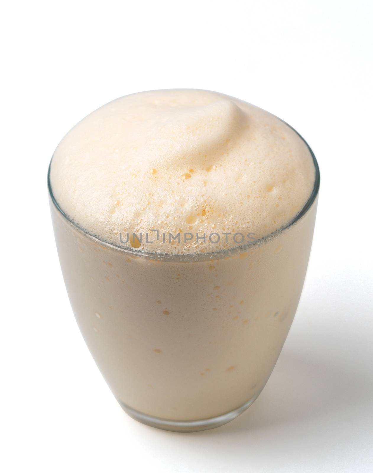 Vanilla milkshake with foam isolated on white by fascinadora