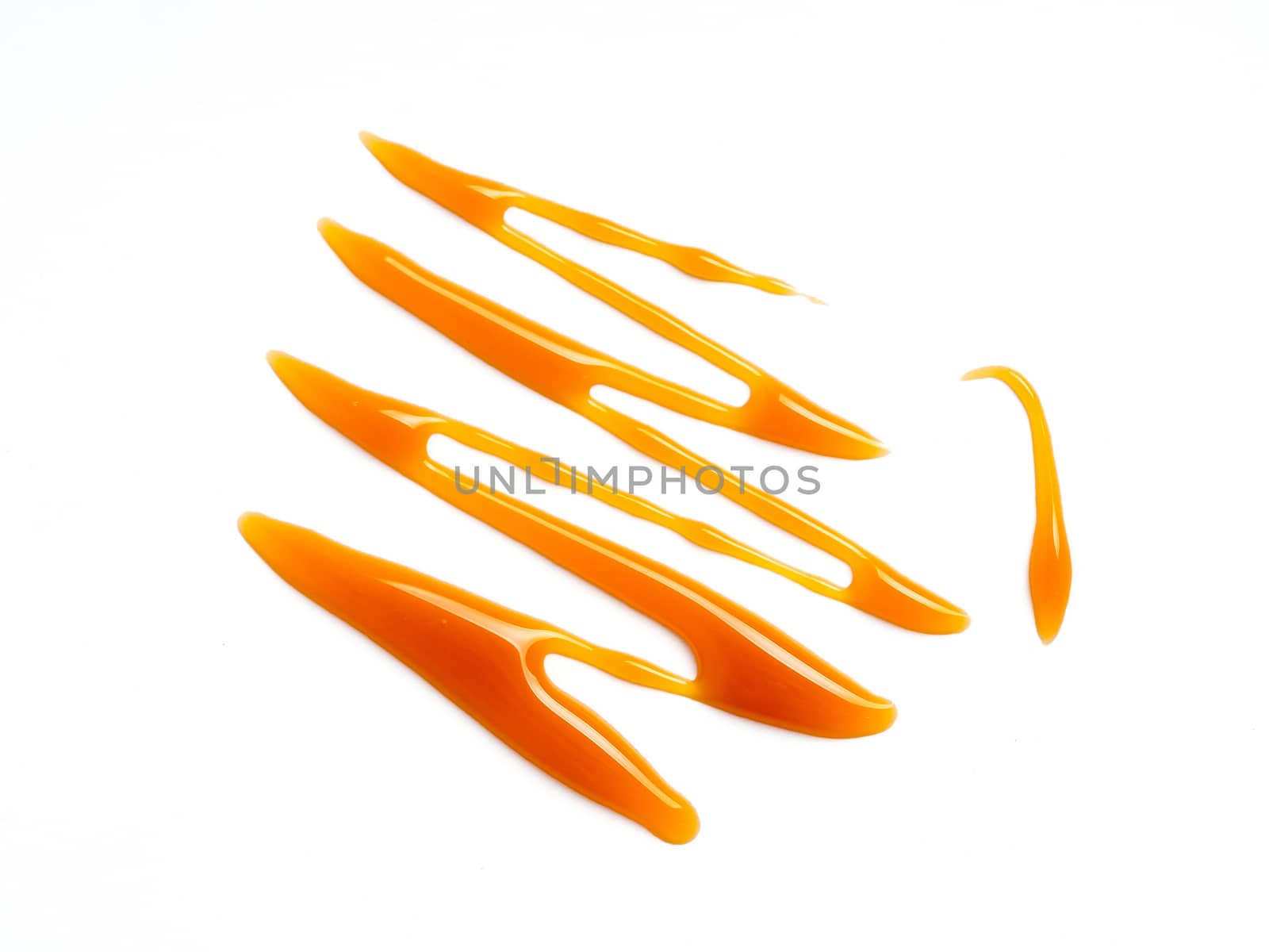 sweet caramel sauce isolated on white background Top view or flat lay. Caramel isolated on white with clipping path.