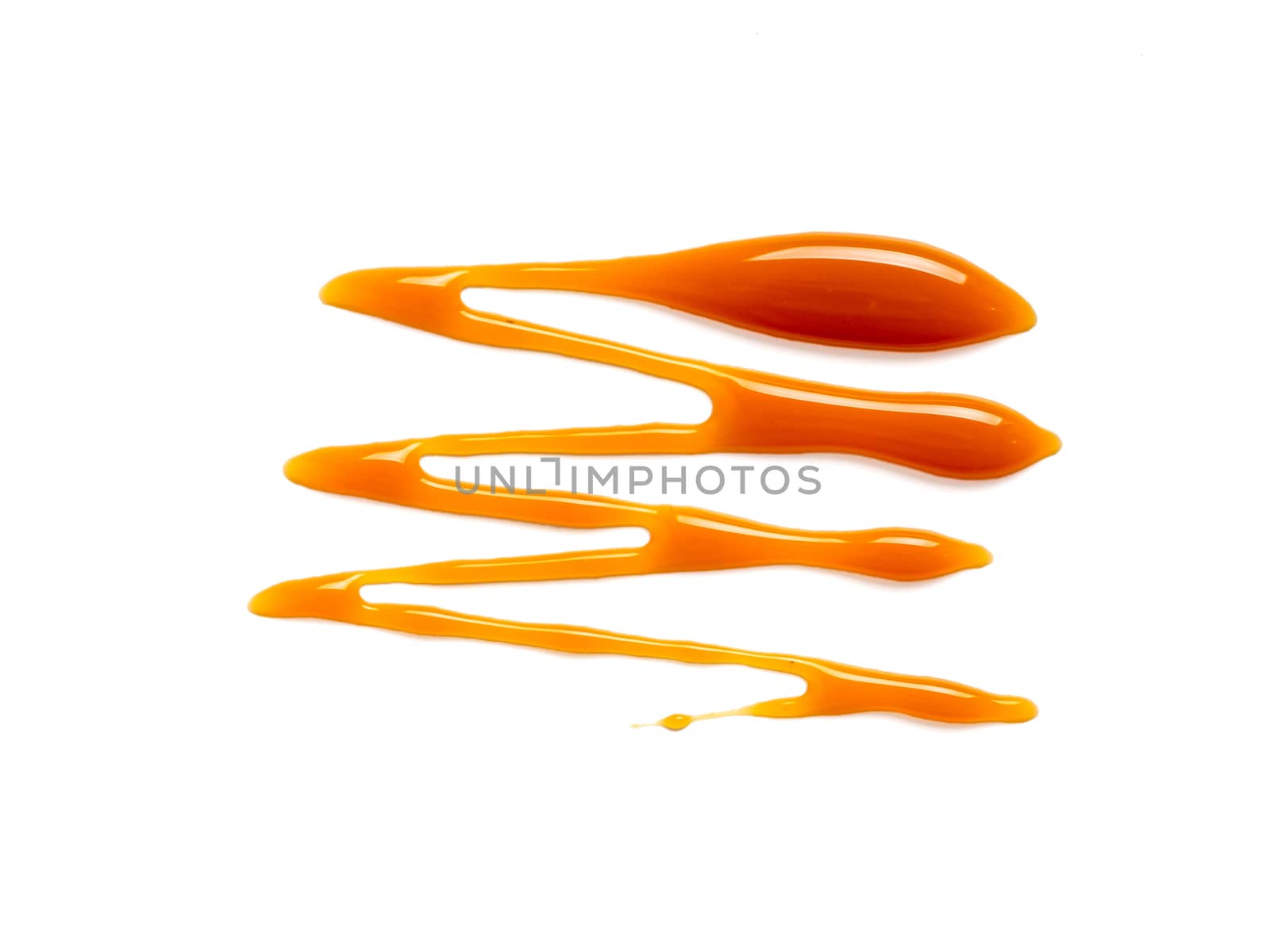 sweet caramel sauce isolated on white background Top view or flat lay. Caramel isolated on white with clipping path.