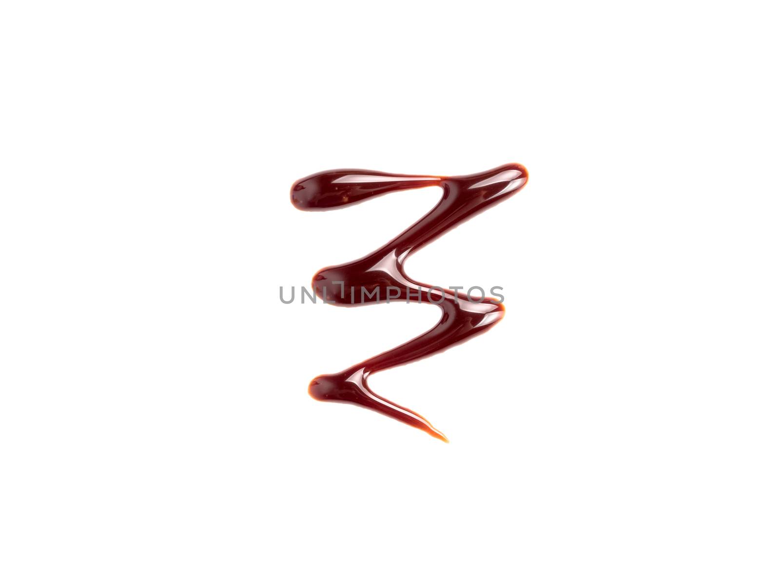 Chocolate sauce on white. Abstract lines made of chocolate or soy sauce isolated on white background