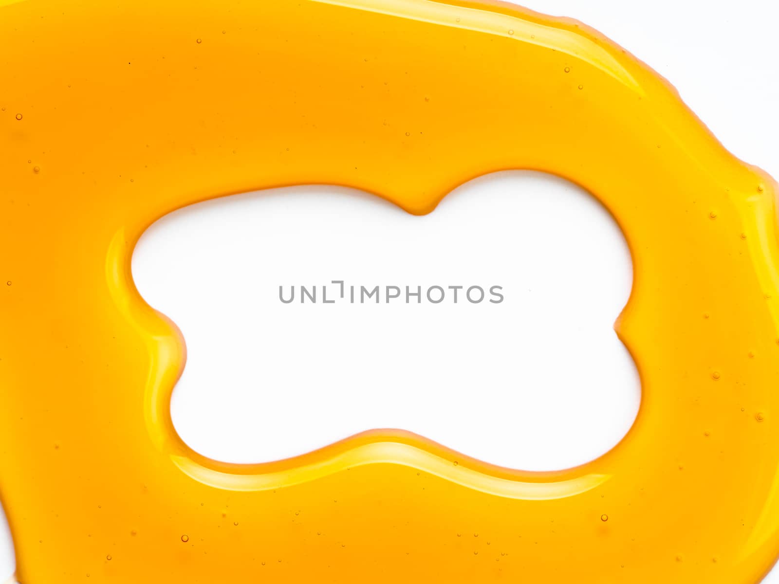 Abstract pattern from honey. Can use for design. Copy space for text. Honey background isolated on white with clipping path.