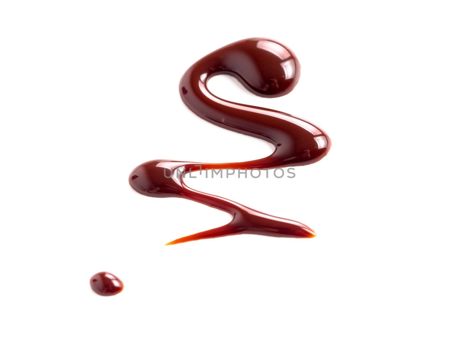 Chocolate sauce on white. Abstract lines made of chocolate or soy sauce isolated on white background