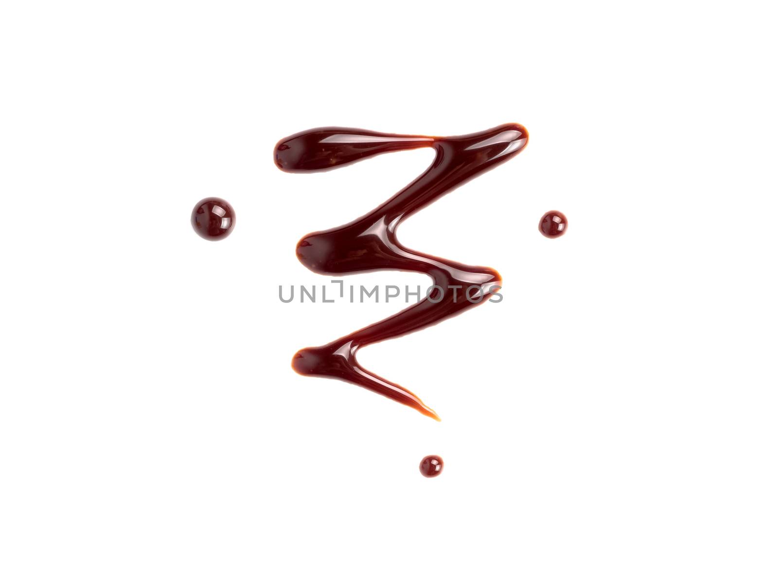 Chocolate sauce on white. Abstract lines made of chocolate or soy sauce isolated on white background