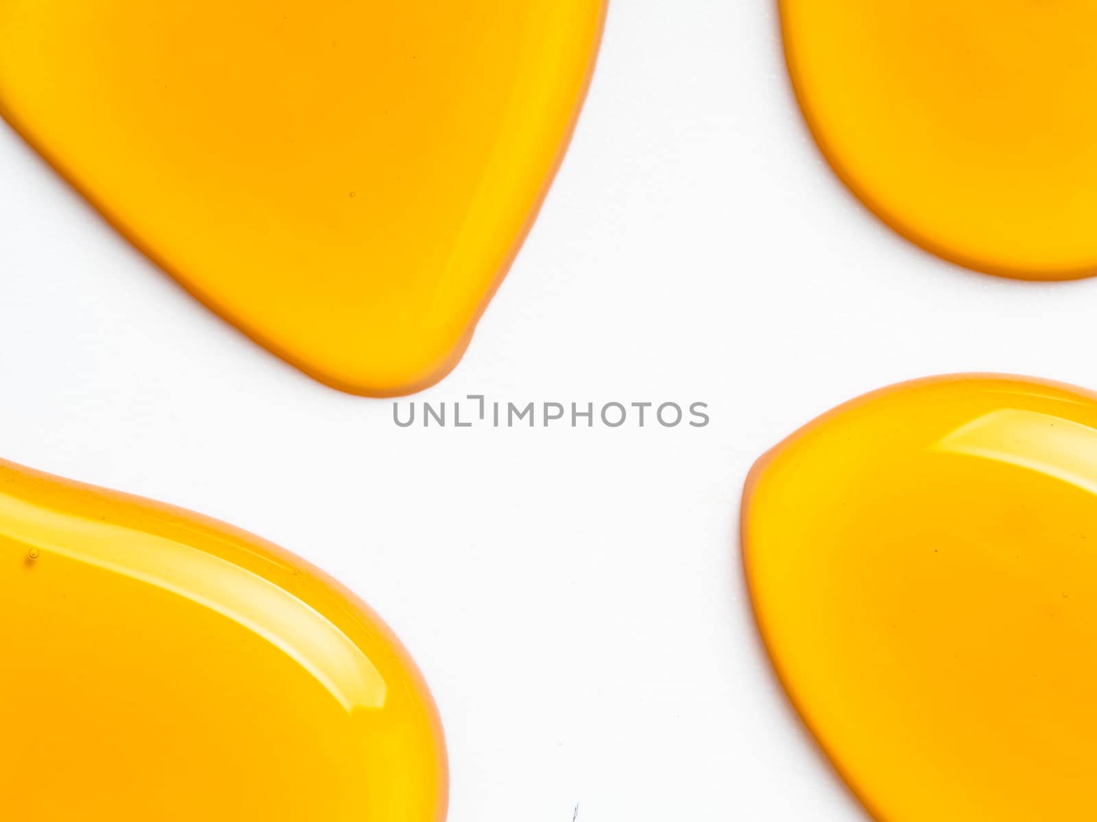 Honey drops. Abstract pattern from honey drops. Isolated on white with clipping path. Can use for design. Copy space for text.