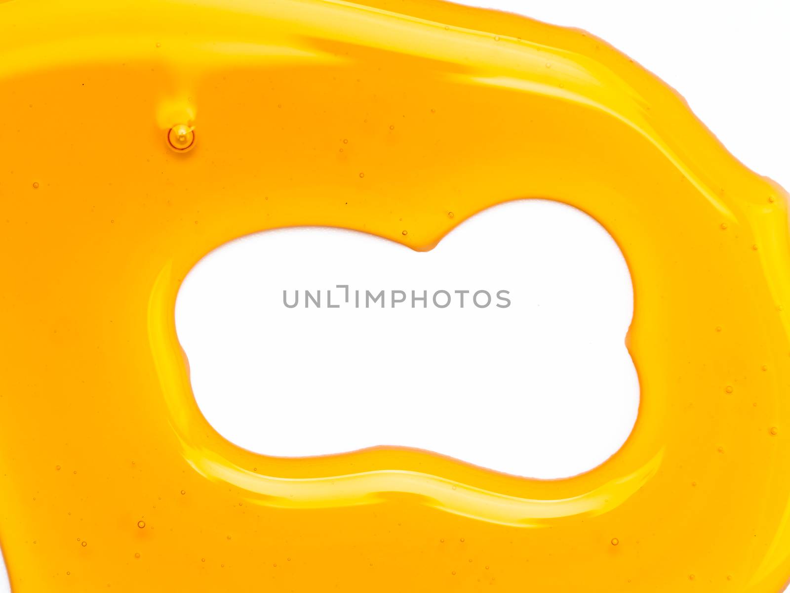 Abstract pattern from honey. Can use for design. Copy space for text. Honey background isolated on white with clipping path.