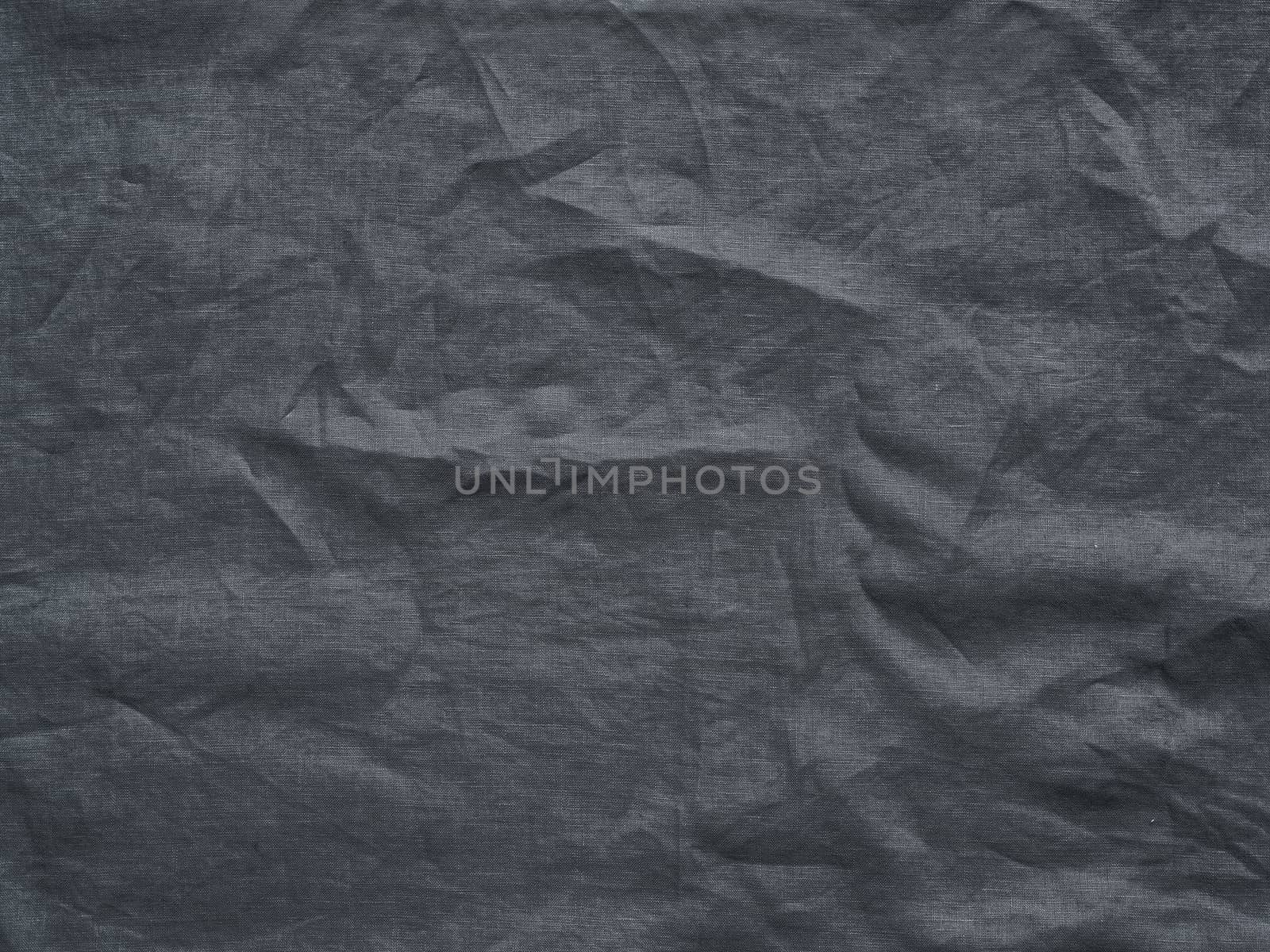 Gray linen texture as background. Gray linen crumpled tablecloth. Can use as mock up for design. Copy space for text