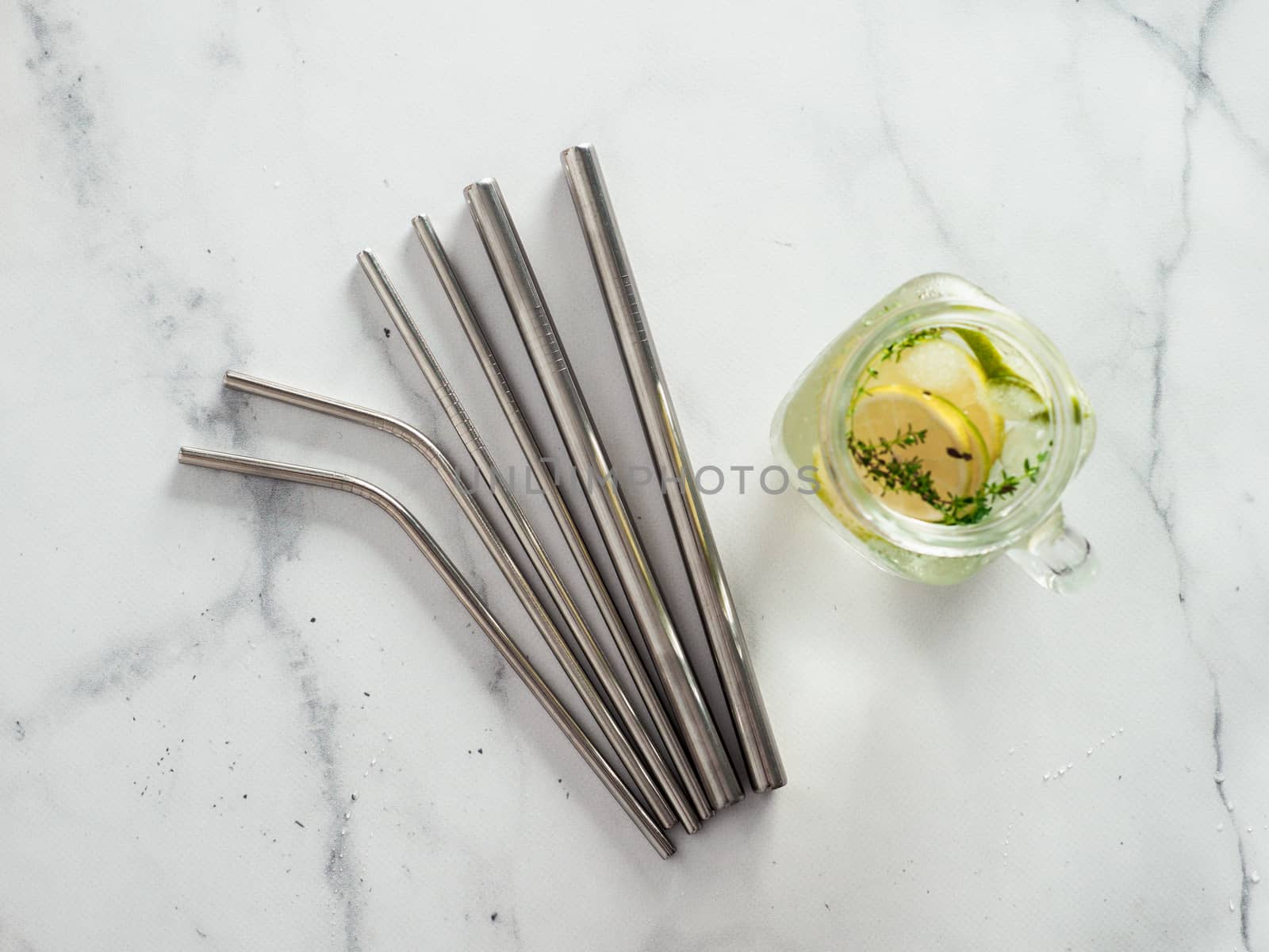 Metal recyclable drinking straws, flat lay by fascinadora