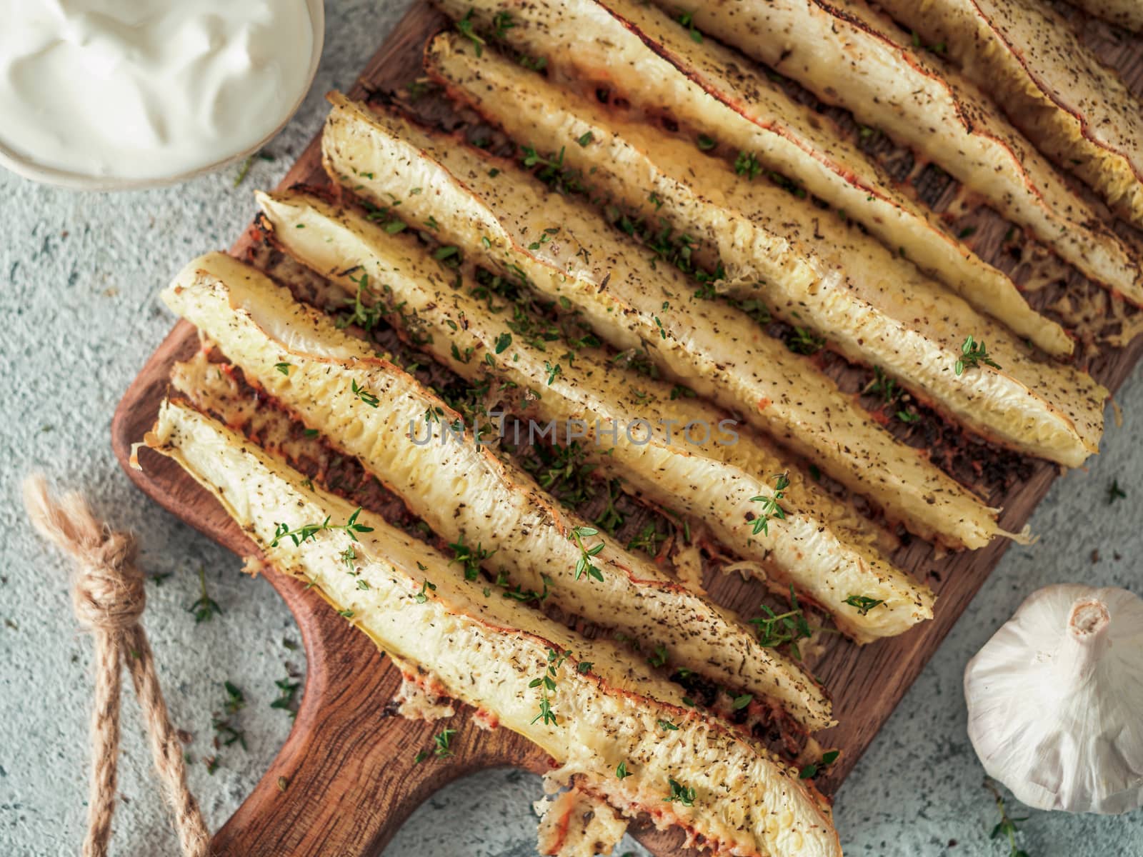 Baked Parmesan Garlic Zucchini. Ideas and recipes for easy and healthy lunch or dinner - oven baked zucchini. Top view or flat lay.