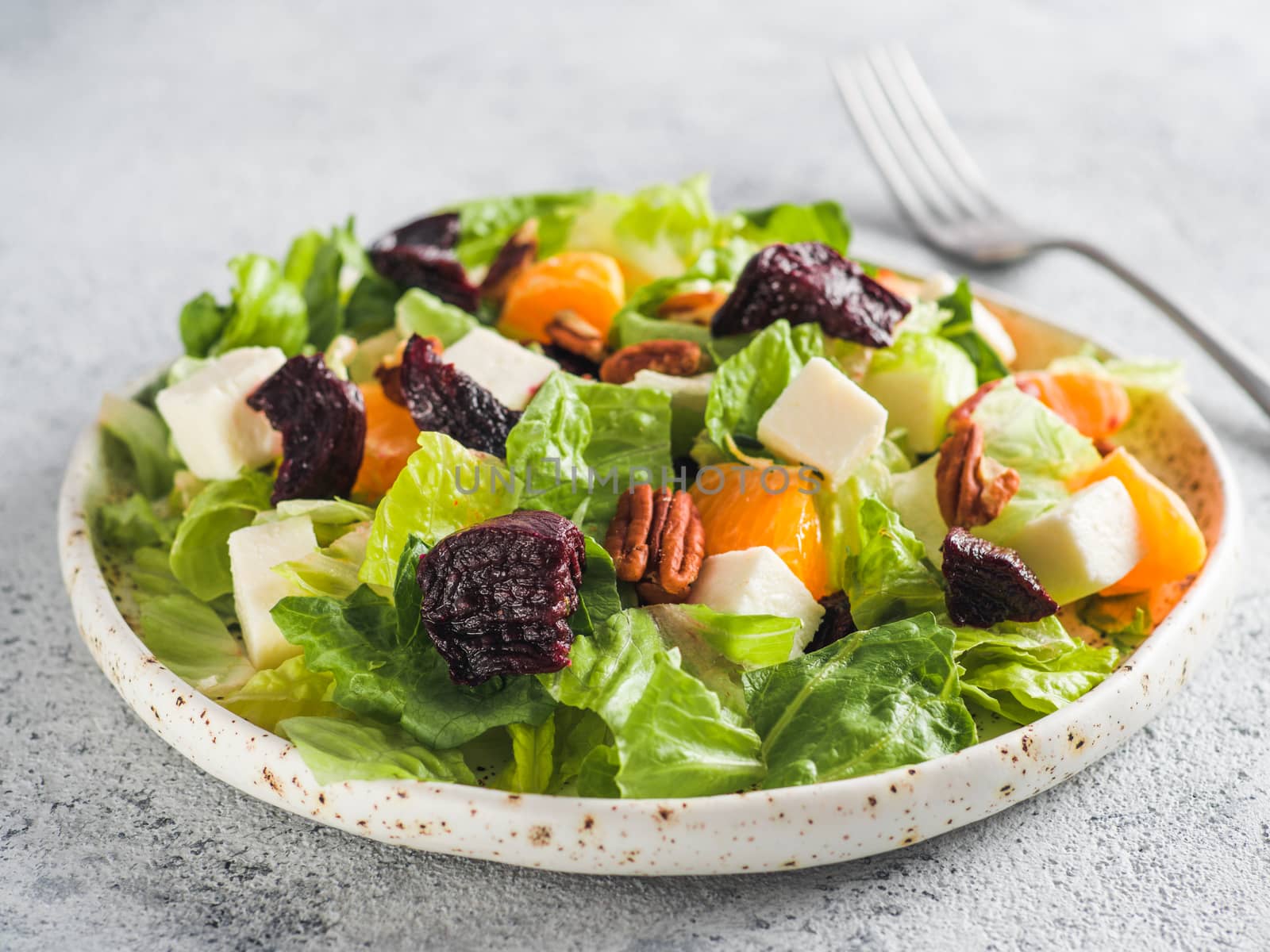 Beetroot, Feta Cheese and Orange Salad. Close up. Top view or flat-lay. Copy space for text. Gray concrete background