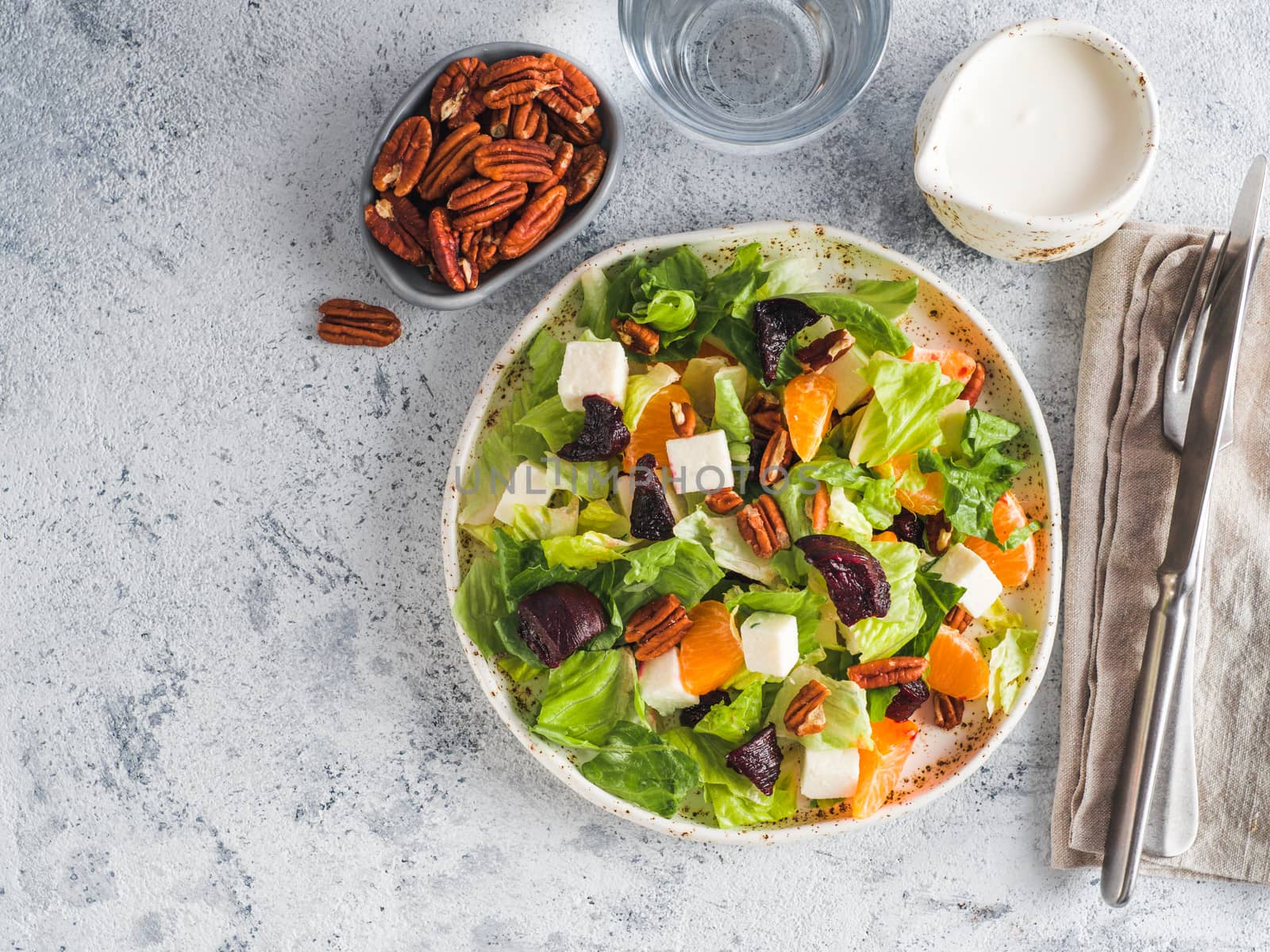 Beetroot, Feta Cheese and Orange Salad. Close up. Top view or flat-lay. Copy space for text. Gray concrete background