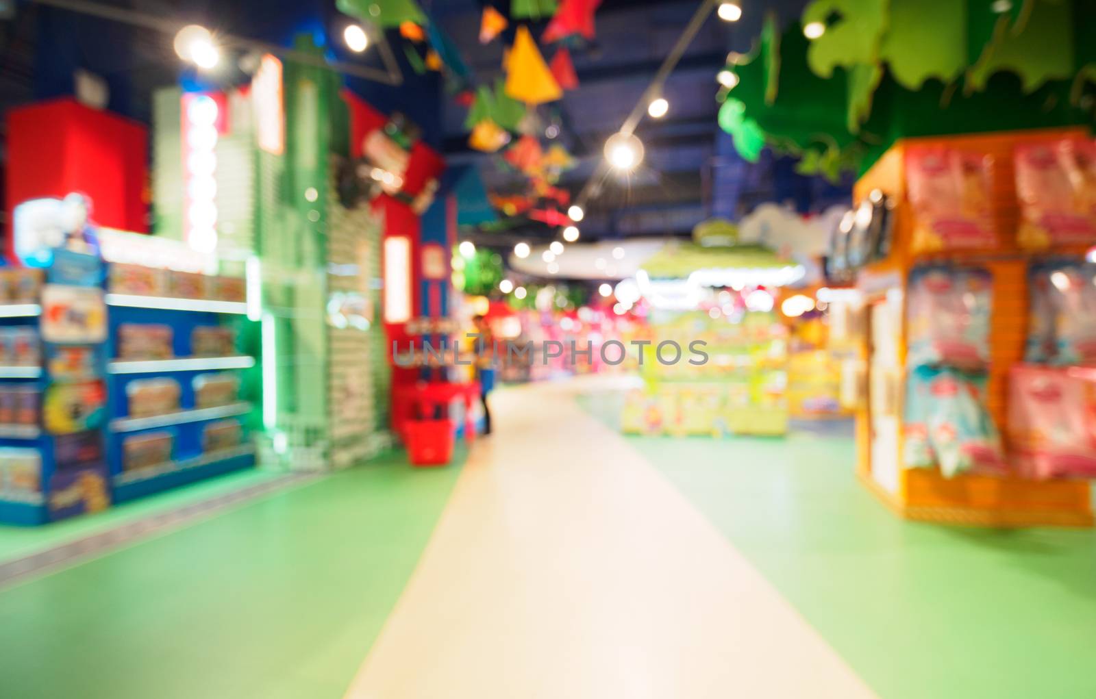 Blurred of kids toy store background with bokhe. Purple and yellow colors of toys shop interior, copy space