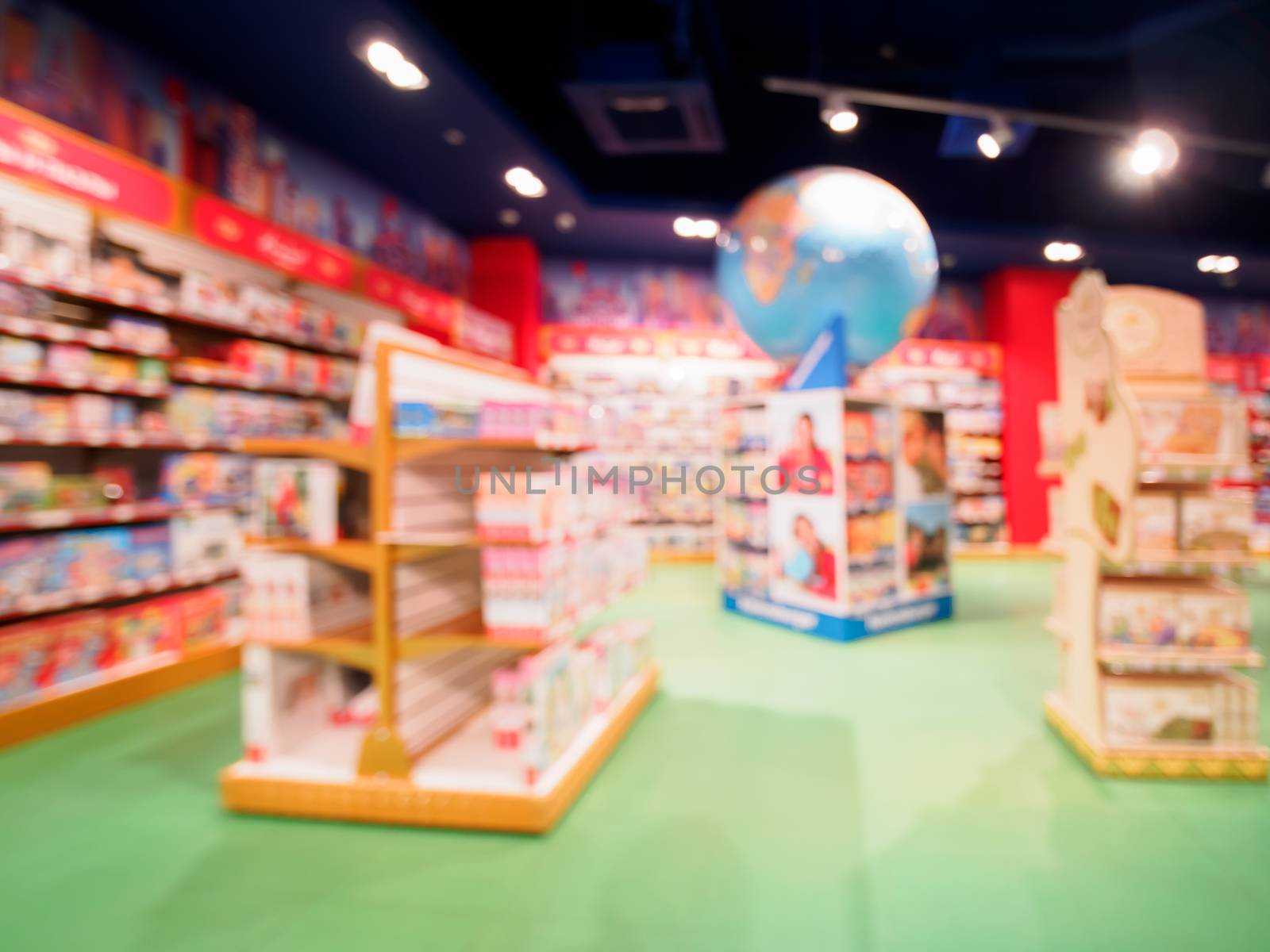 Blurred of kids toy store background with bokhe. Purple and yellow colors of toys shop interior, copy space