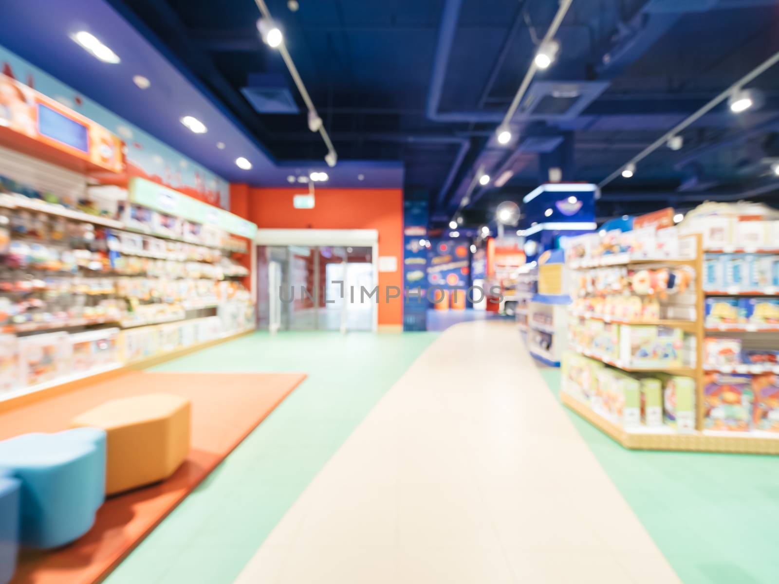 Blurred of kids toy store background with bokhe. Purple and yellow colors of toys shop interior, copy space