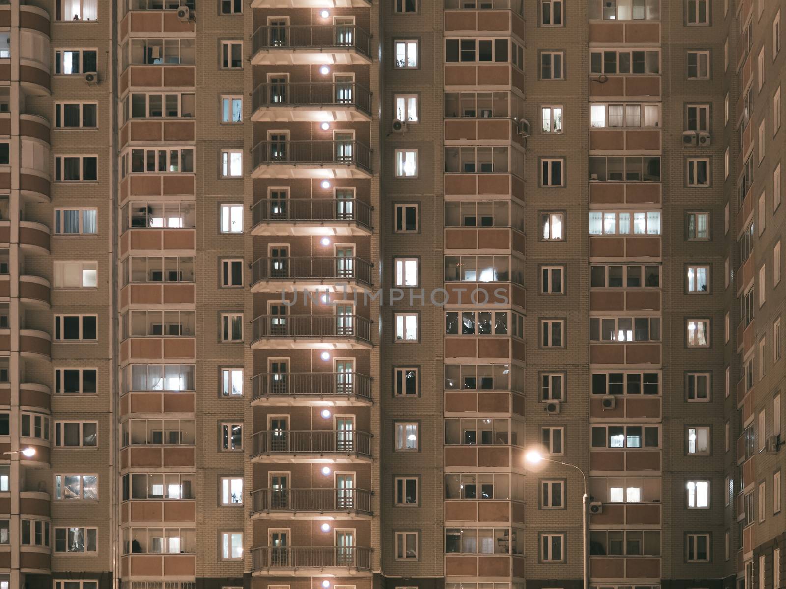 Night view of exterior apartment building. High rise apartments in night light