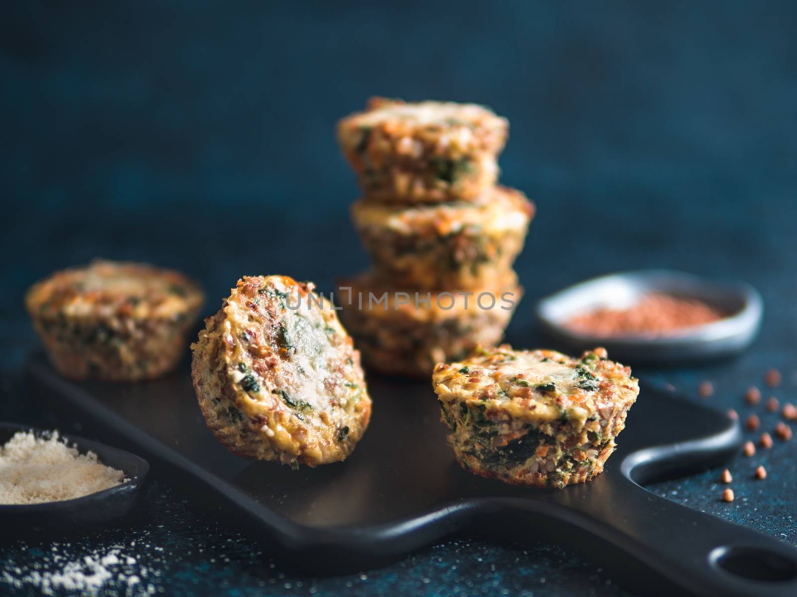 Buckwheat casserole with spinach,carrot,parmesan cheese.Baked eggs with buckwheat,vegetables and cheese.Ideas and recipes healthy easy breakfast,lunch,kids meal,snack - vegetables muffins.Copy space