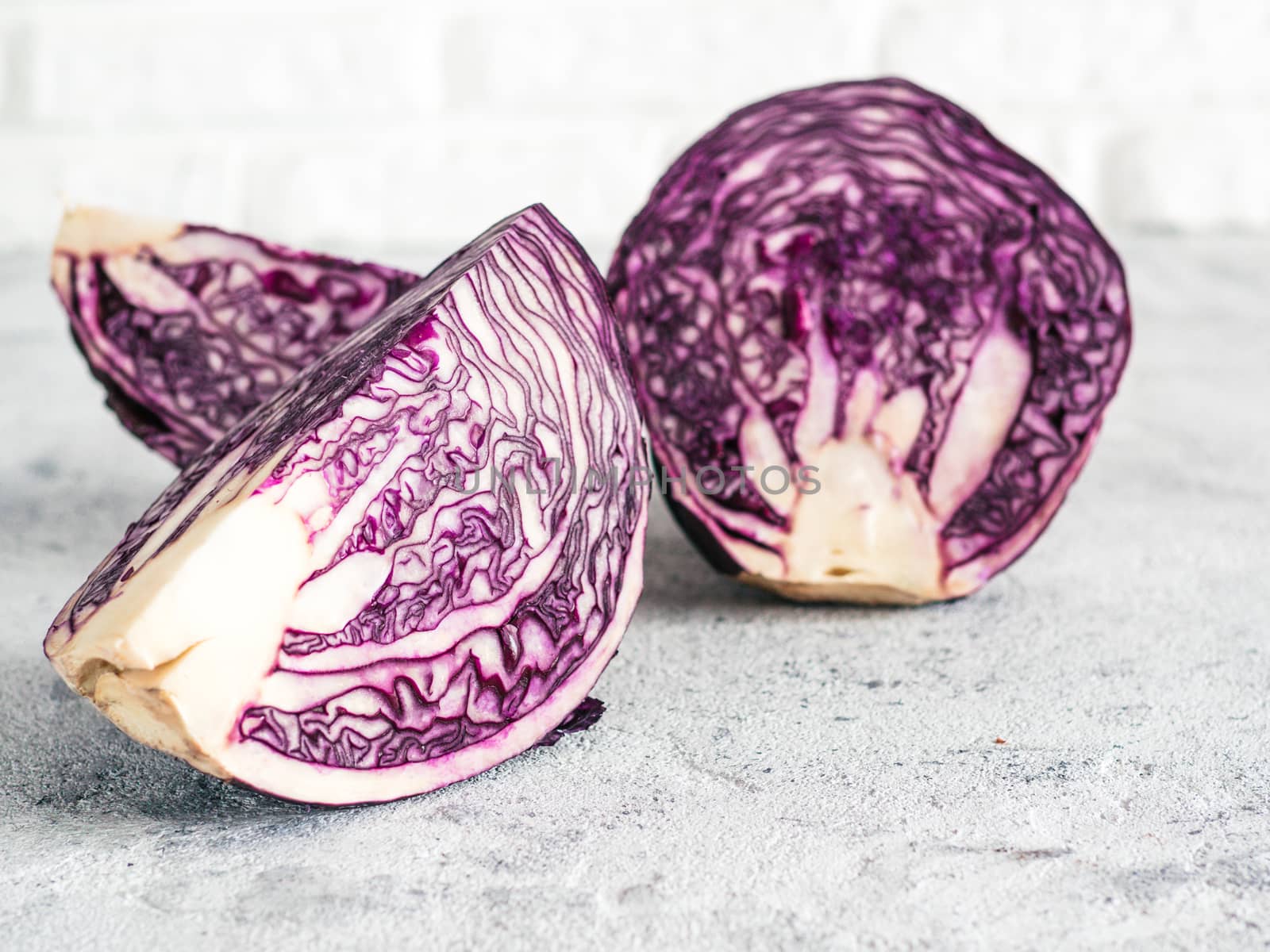red cabbage on gray cement background. Front side view of red cabbage on gray table with copy space for text. Background for healthy eat, vegetarian meny