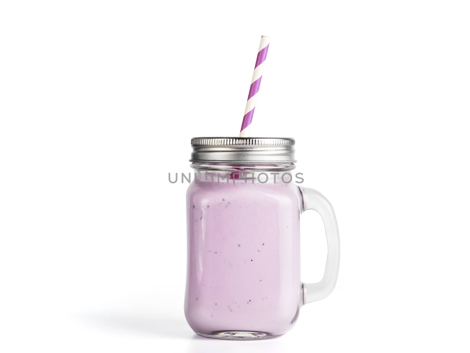 Blueberry smoothie in mason jar glass. Isolated on white with clipping path.