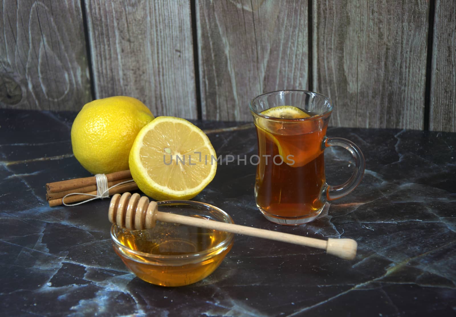 Cold medicine, tea with lemons, honey and cinnamon sticks.