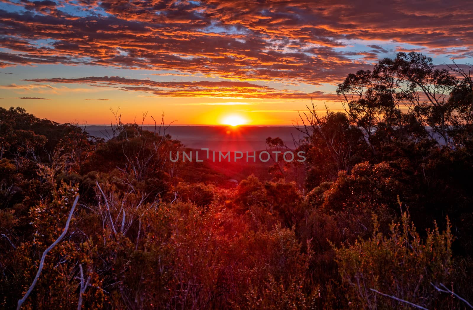 Glorious sunrise views to horizon across mountain ranges by lovleah