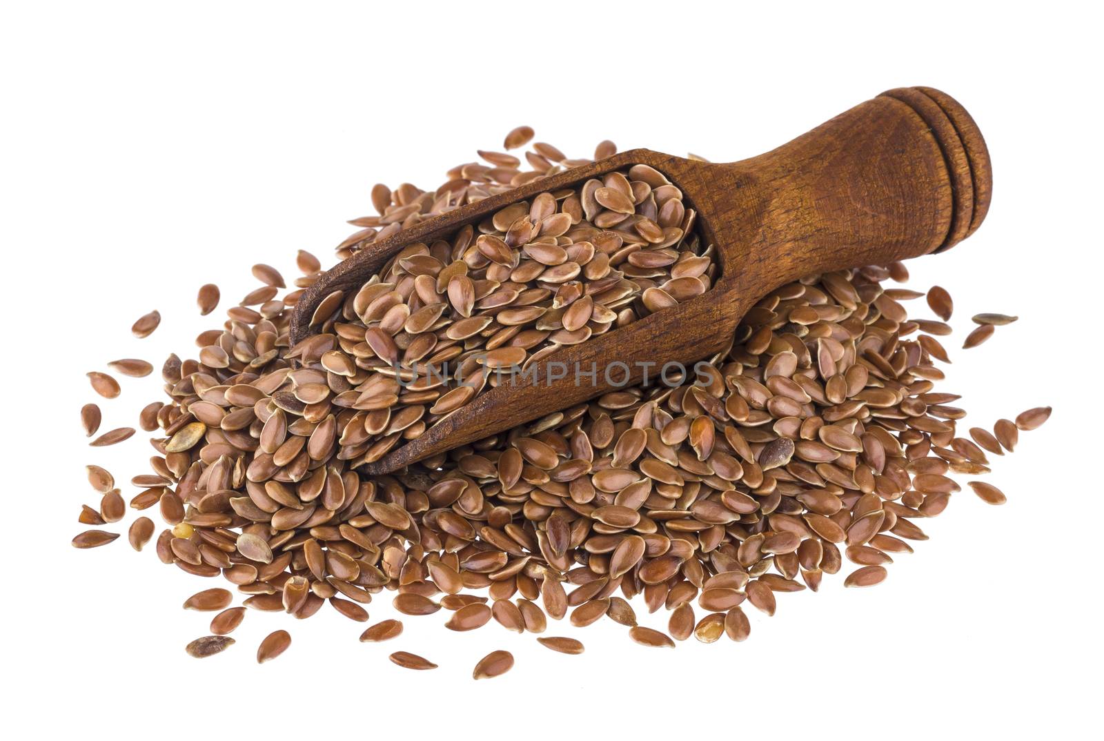 Flax seeds in wooden scoop isolated on white background close-up