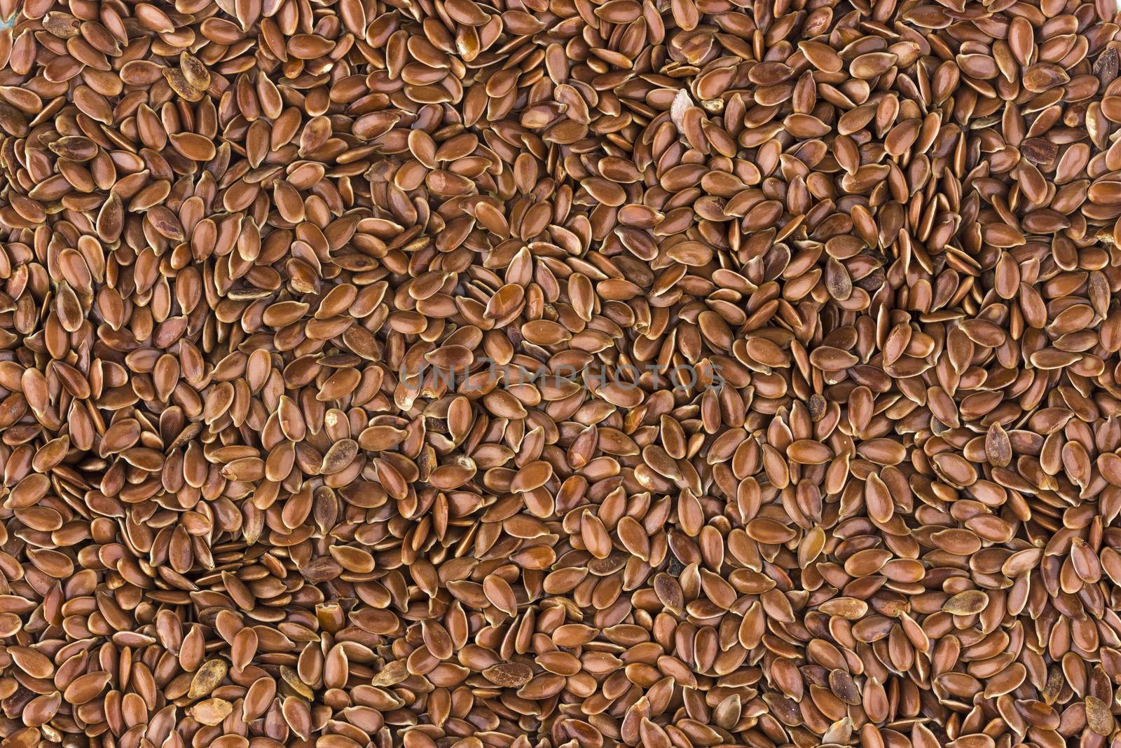 Flax seeds background, linseed texture close-up, top view