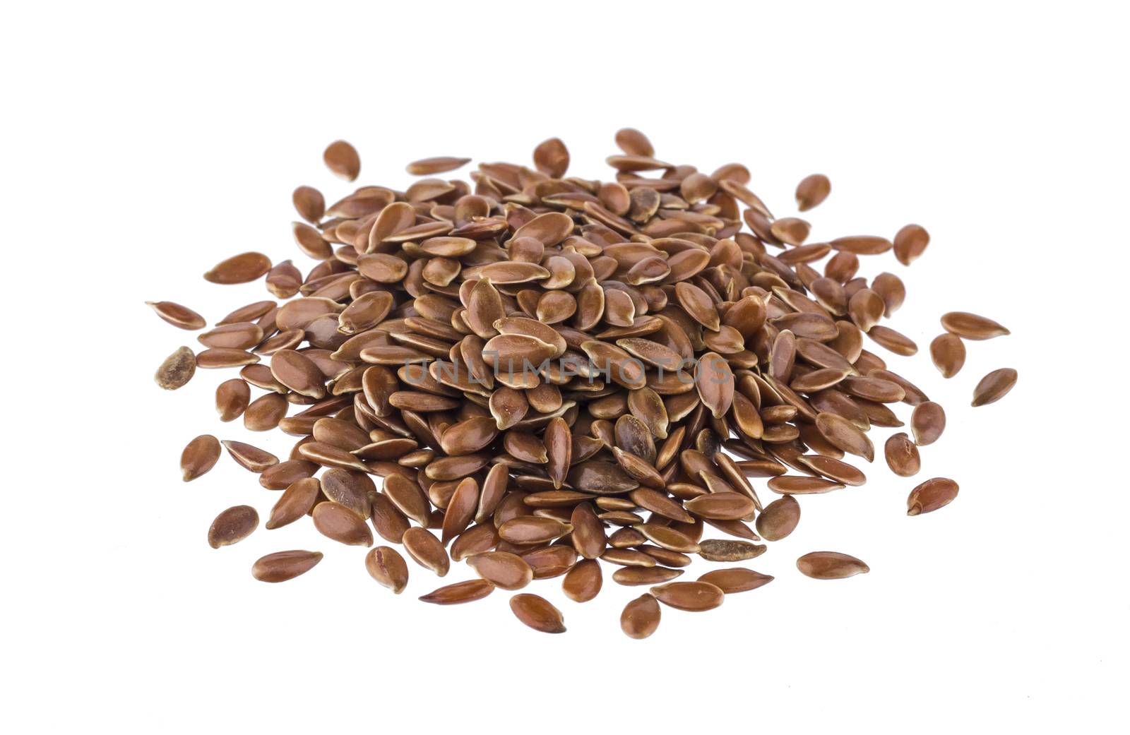Pile of flax seeds isolated on white background close-up