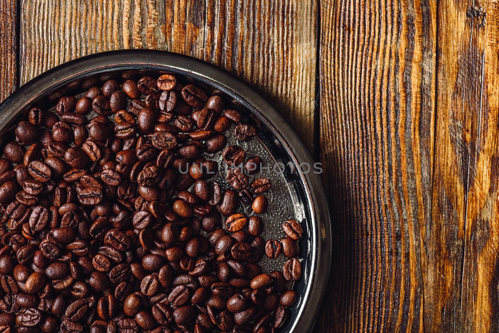 Coffee Beans on Metal Plate. Copy Space.