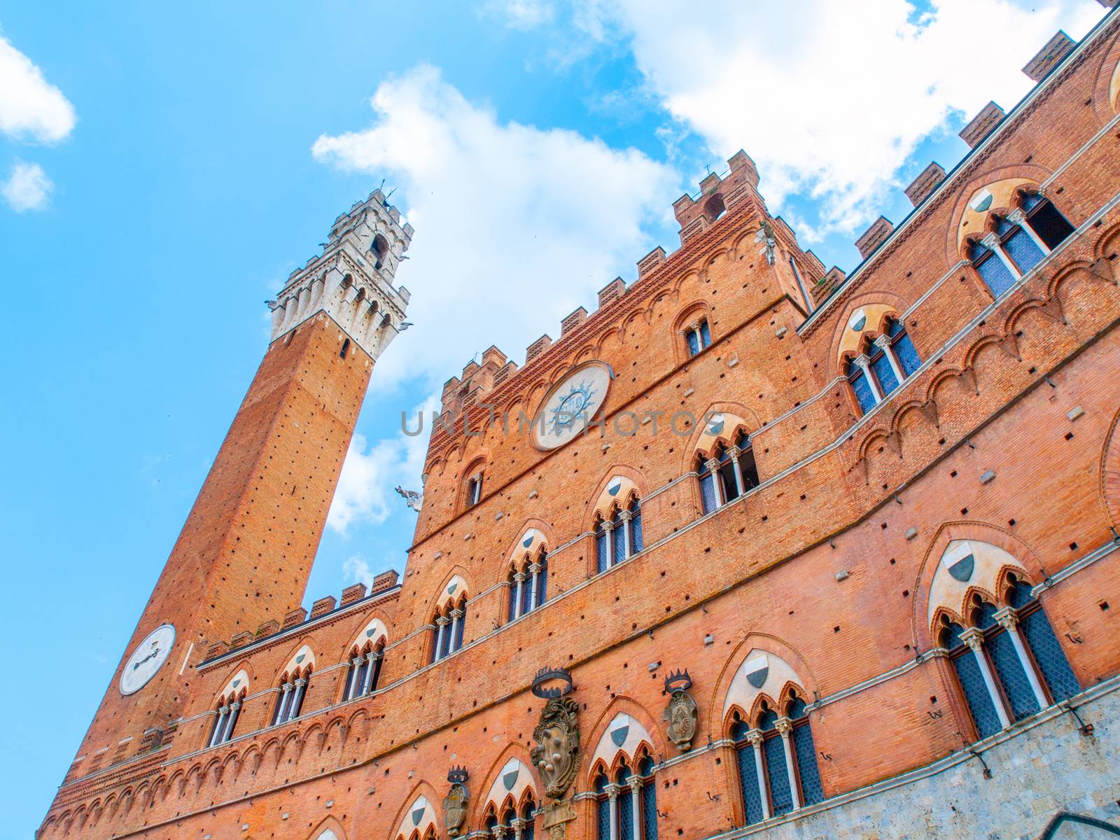 Bell tower, Torre del Mangia, of the Town Hall, Palazzo Pubblico, at the Piazza del Campo, Siena, Italy by pyty