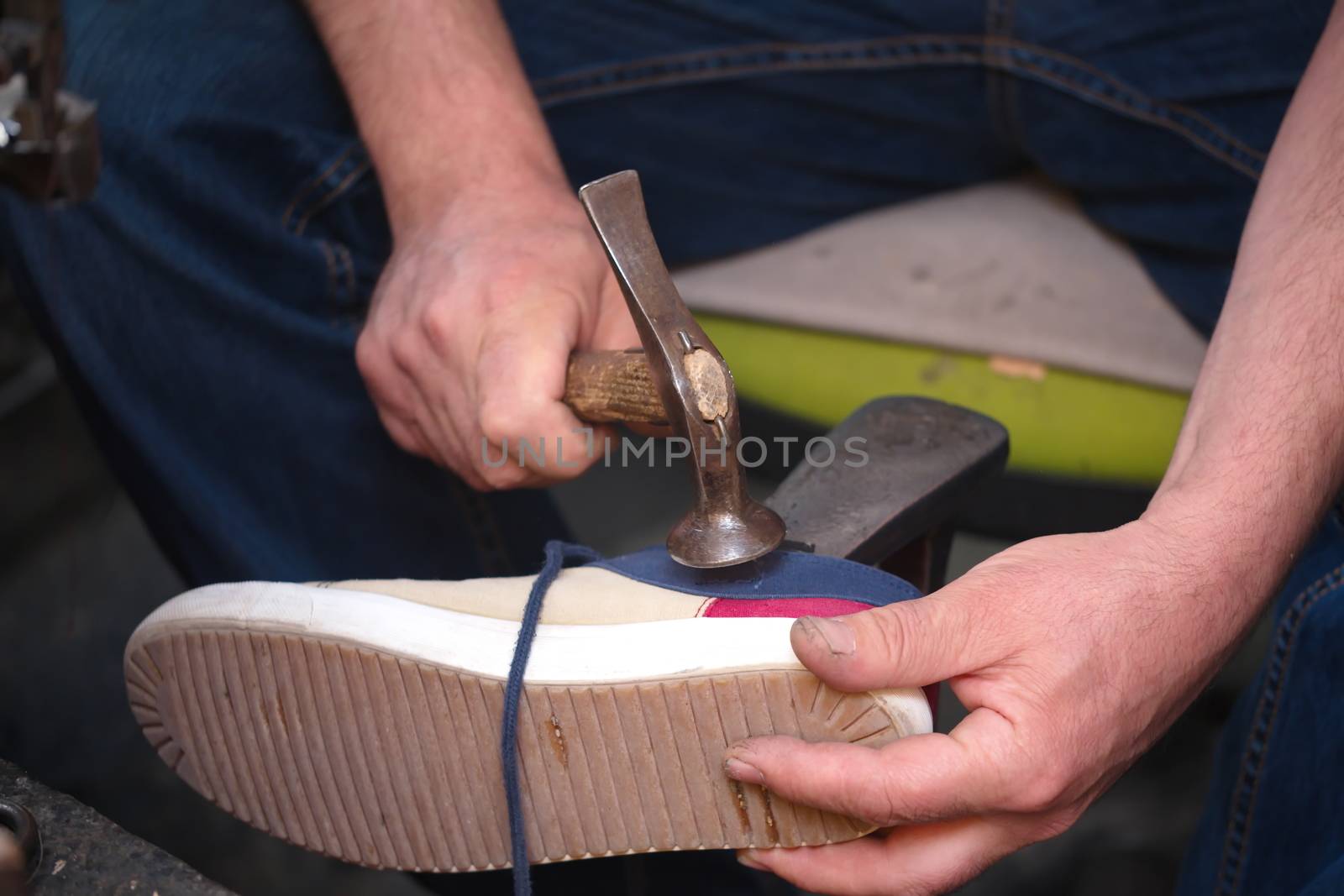 Cobbler. The master worker who repairs the shoe