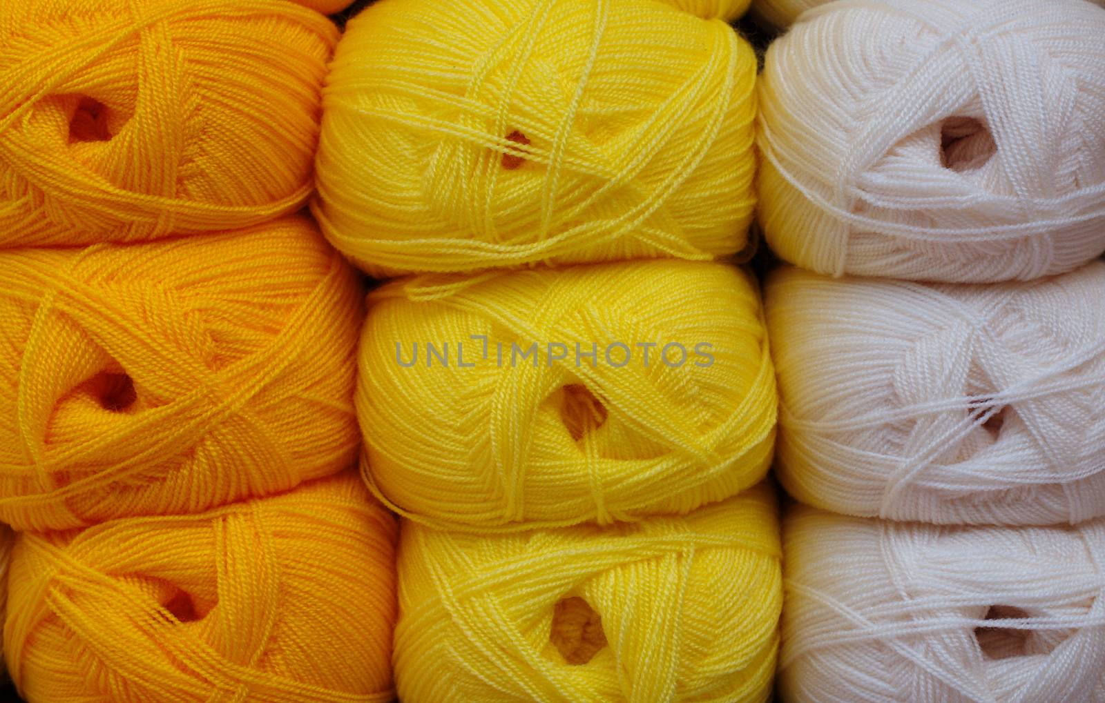 colorful knitting threads. Knitting background, a lot of balls. Knitting yarn for handmade winter clothes