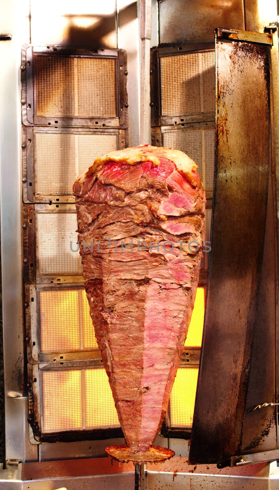 Doner kebab is a Turkish kebab, made of meat cooked on a vertical rotisserie.