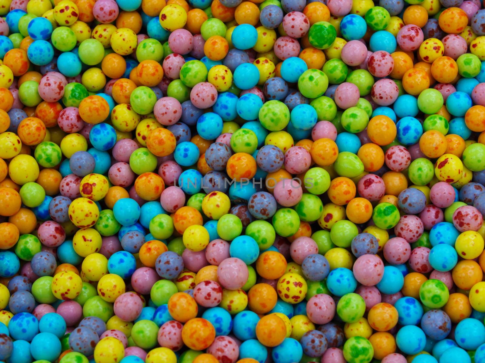 colorful candies, chocolate roasted chickpeas.  top view organic cookie background