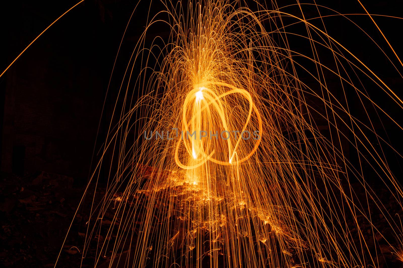 Drawing light at night in an old abandoned building, splashes of light and sparks. Freezelight. by rdv27