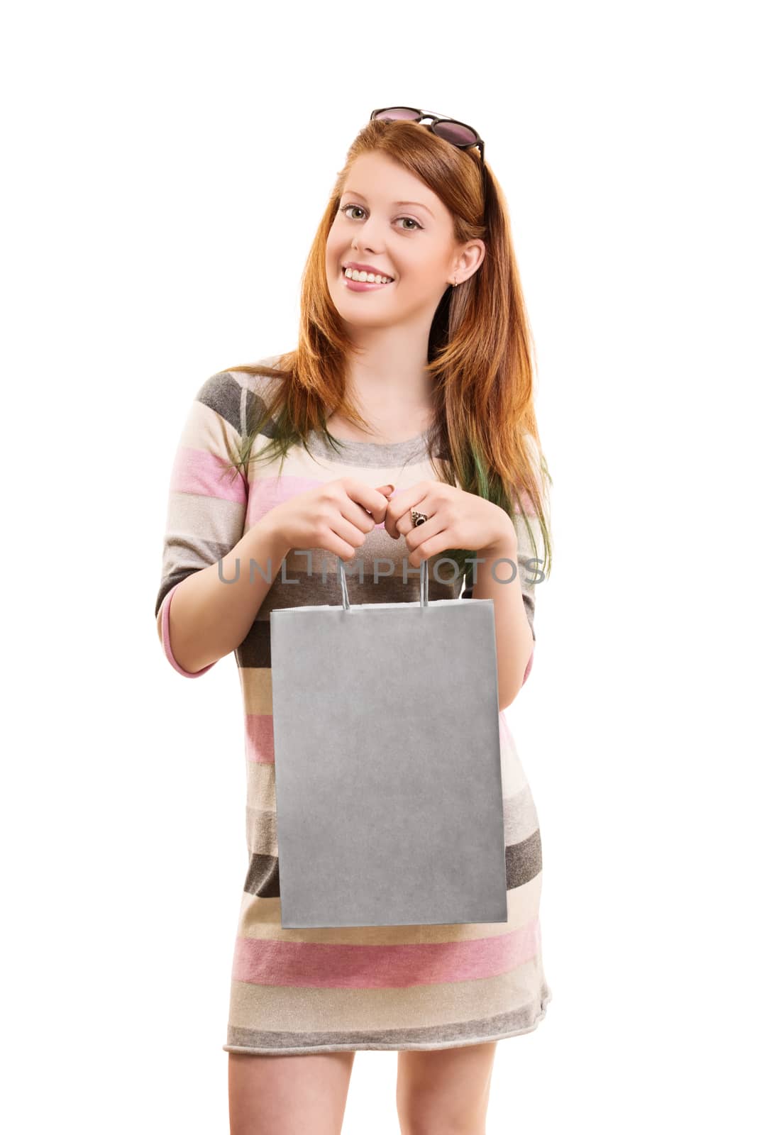 Beautiful young girl holding a shopping bag by Mendelex