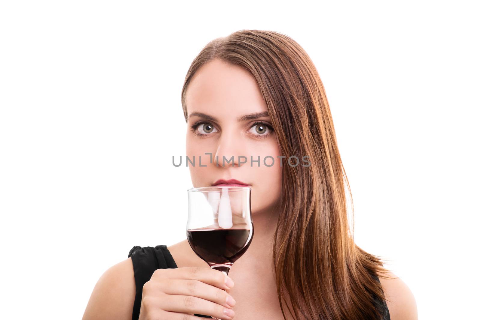 A portrait of a beautiful young woman holding a glass of wine, looking seductively, isolated on white background.