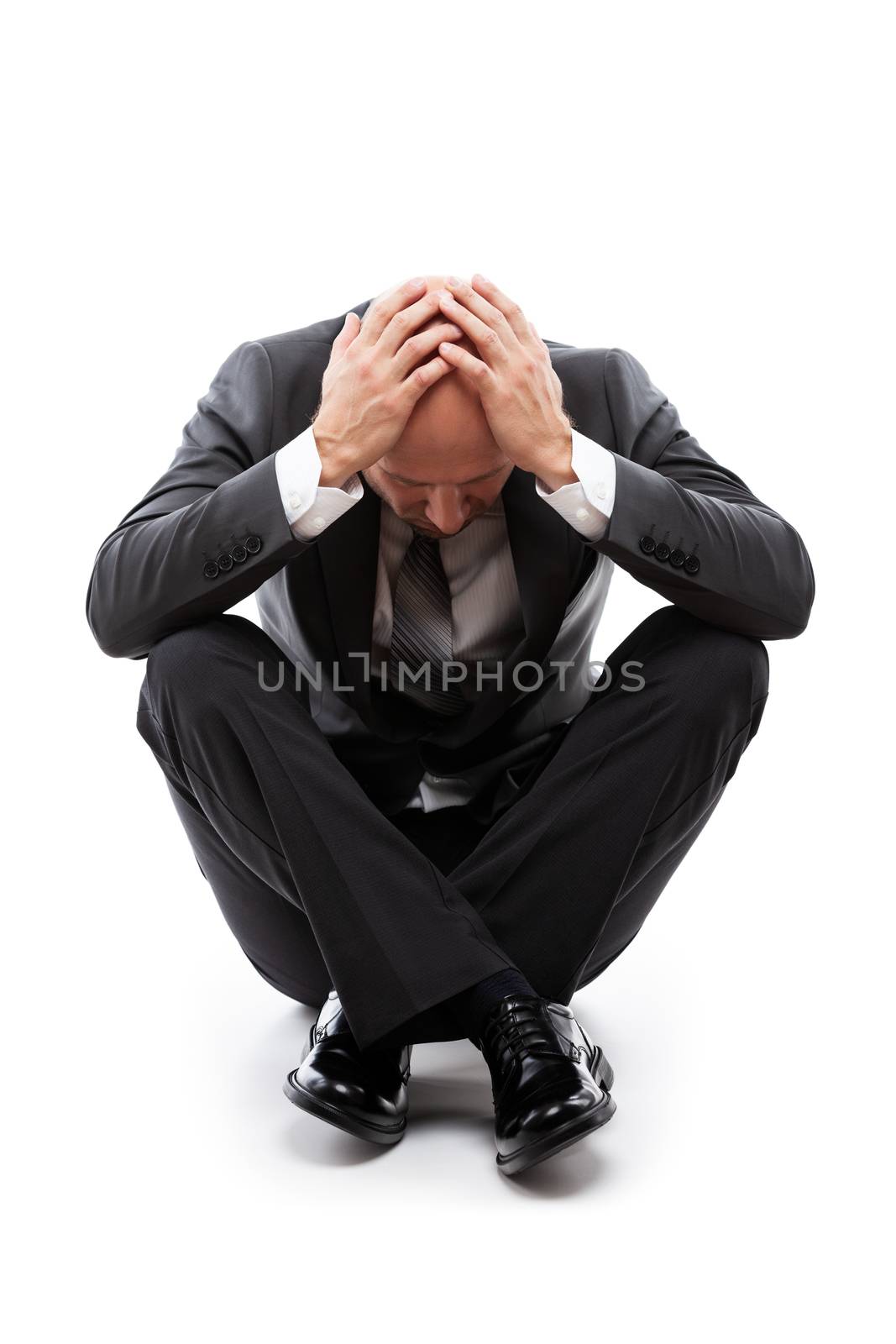 Crying tired or stressed businessman in depression hand hiding face by ia_64
