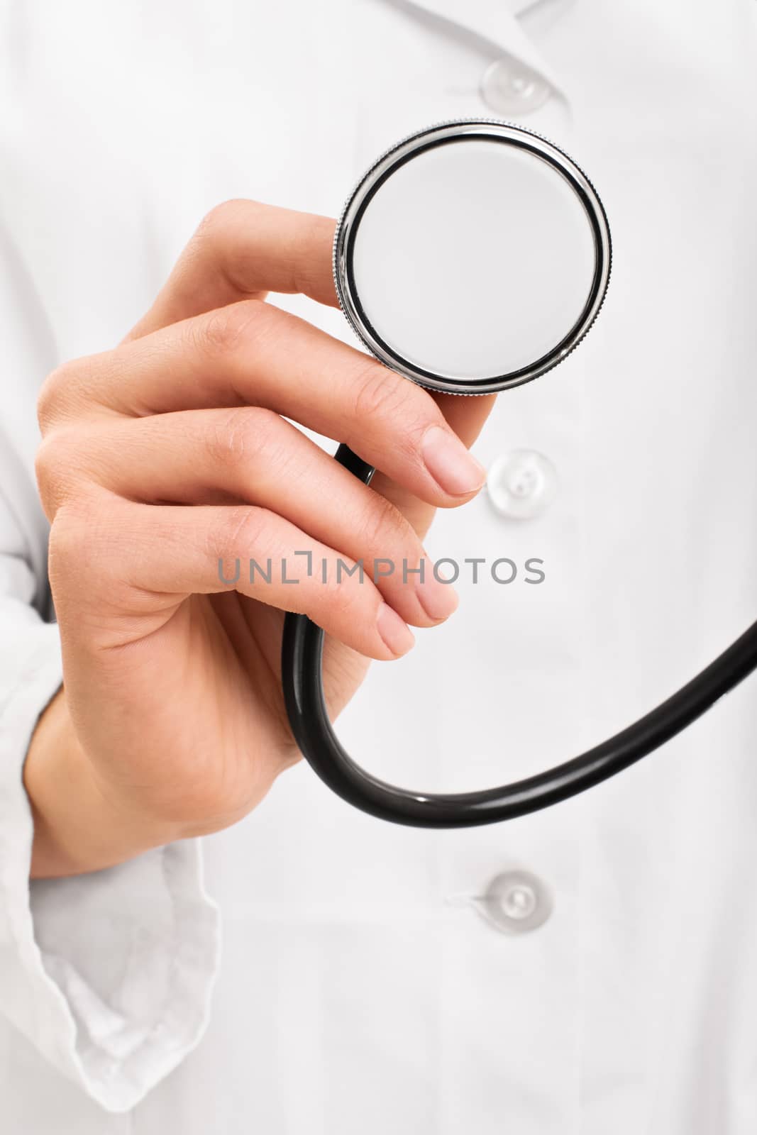 Doctor hand holding a stethoscope by Mendelex