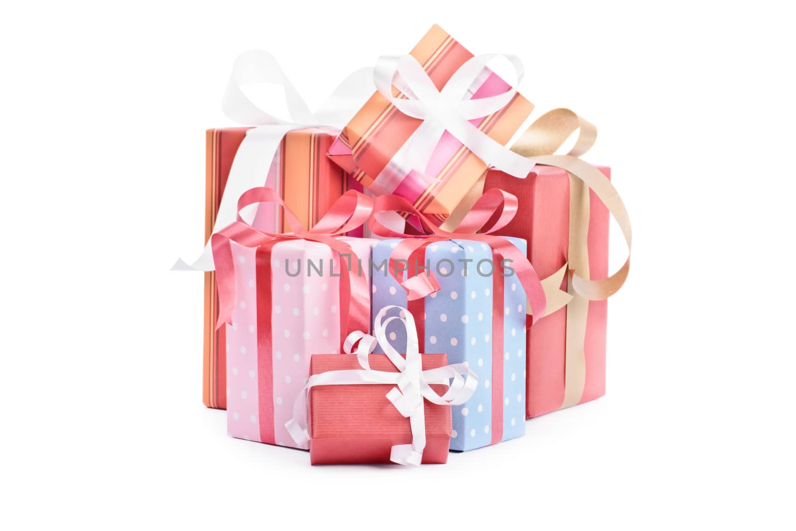 Pile of gifts, wrapped with ribbons, isolated on white background.