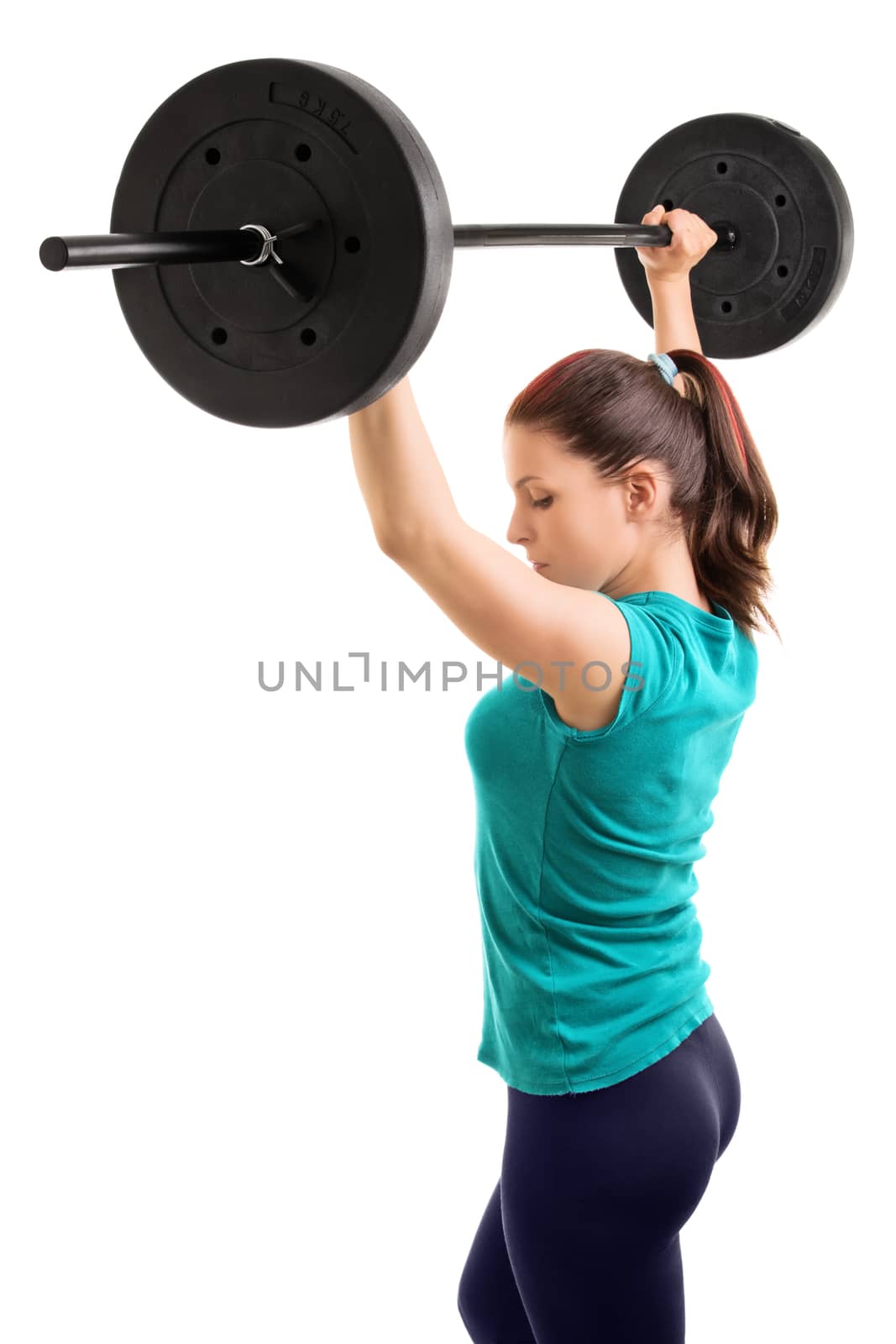 And hold! Young girl athlete holding a barbell up, isolated on white background.