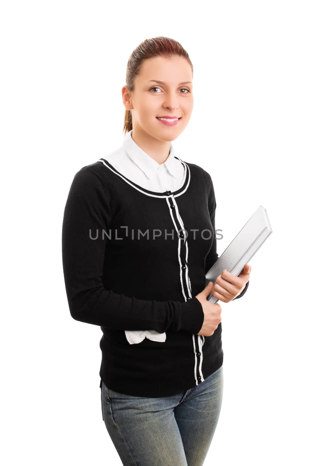 Portrait of a female student in uniform holding some books, isolated on white background.