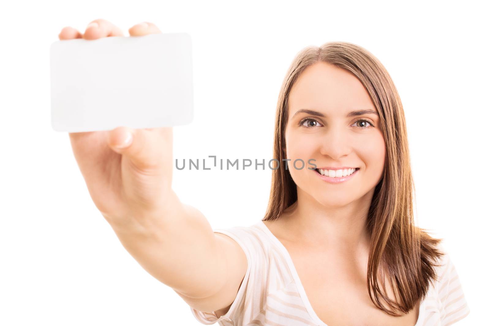 Beautiful young girl holding and presenting a blank information card, isolated on white background.
