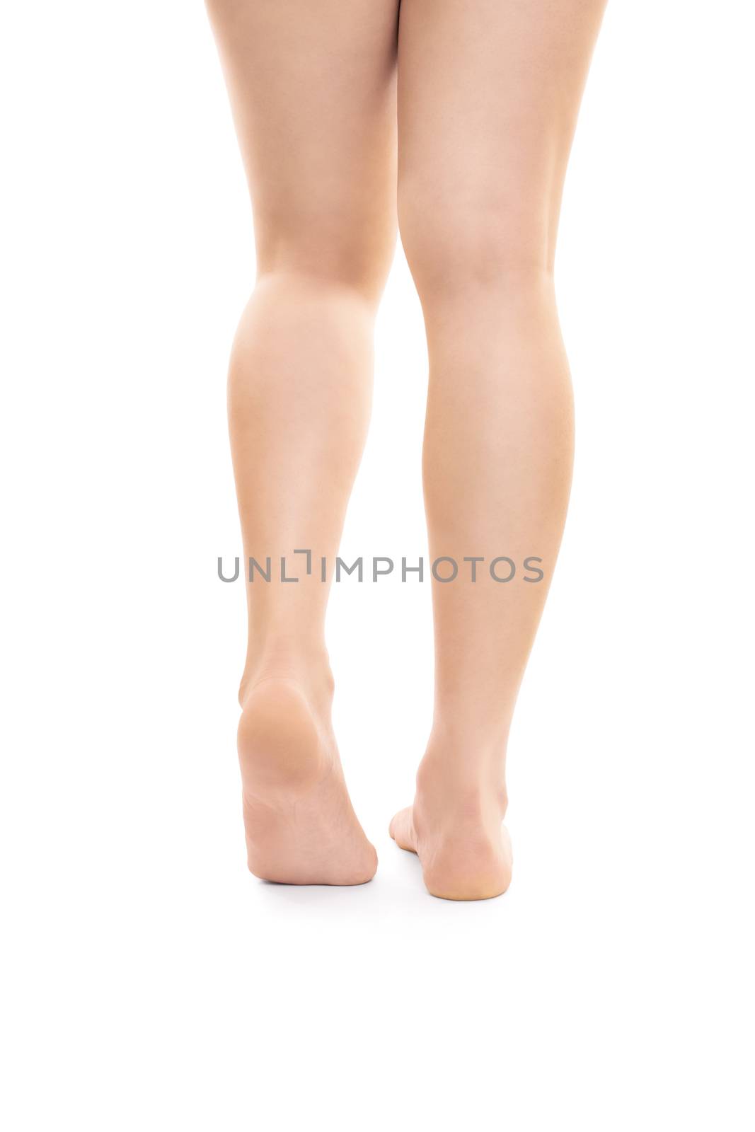 Back shot of smooth beautiful female legs, isolated on white background. Successful hair removal procedure.