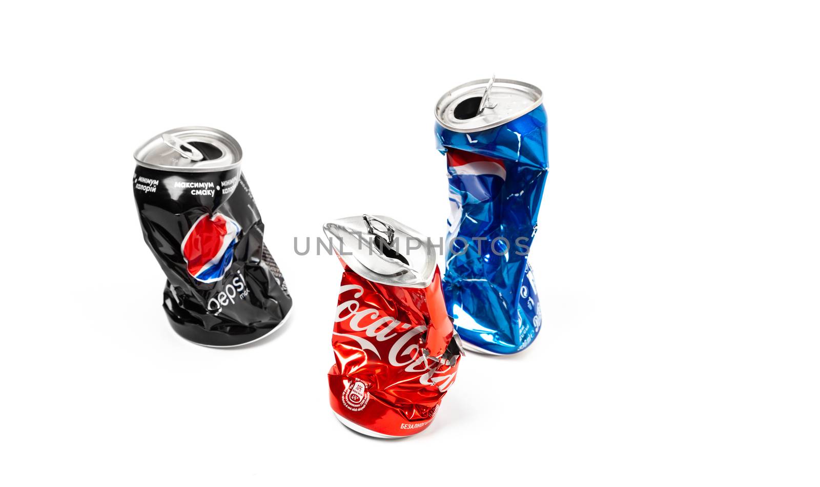 CHISINAU, MOLDOVA - August 20, 2019: Studio photo of empty and crashed Pepsi and Cola aluminum cans isolated on white background
