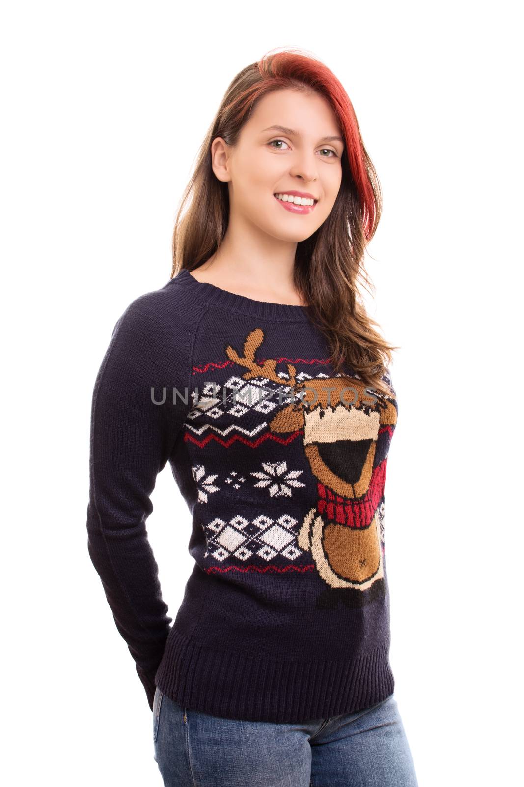 A portrait of a smiling beautiful young girl in christmas sweater, isolated on white background.