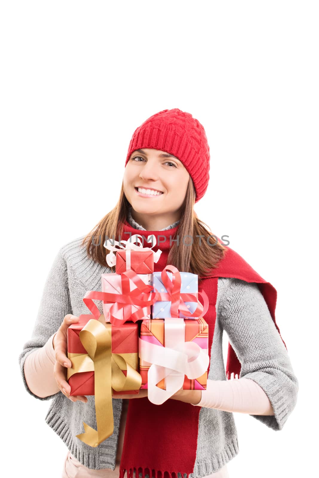 My Christmas shopping is done. Beautiful young woman in winter clothes holding wrapped presents, isolated on white background.