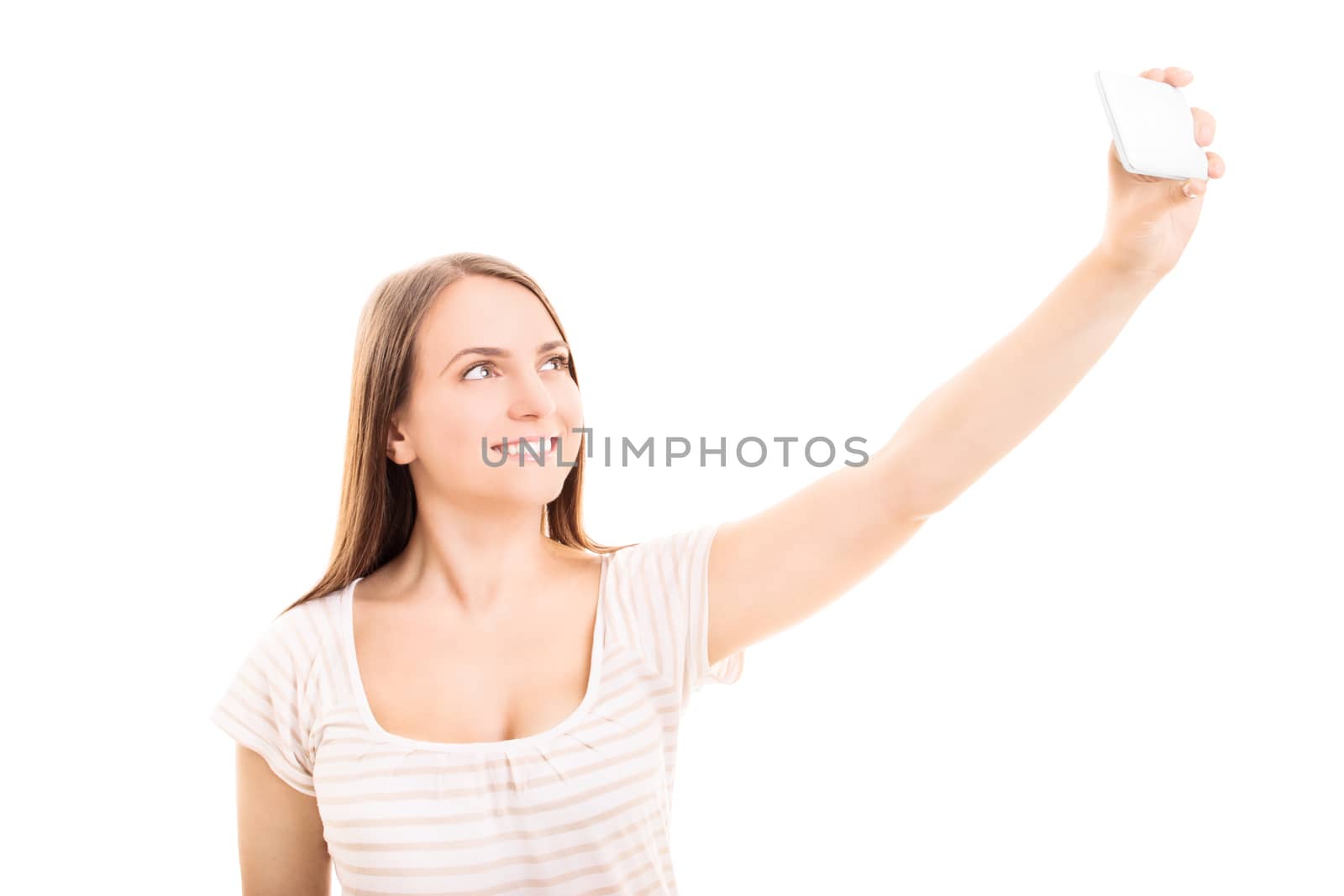 Beautiful smiling young girl taking a selfie, isolated on white background.