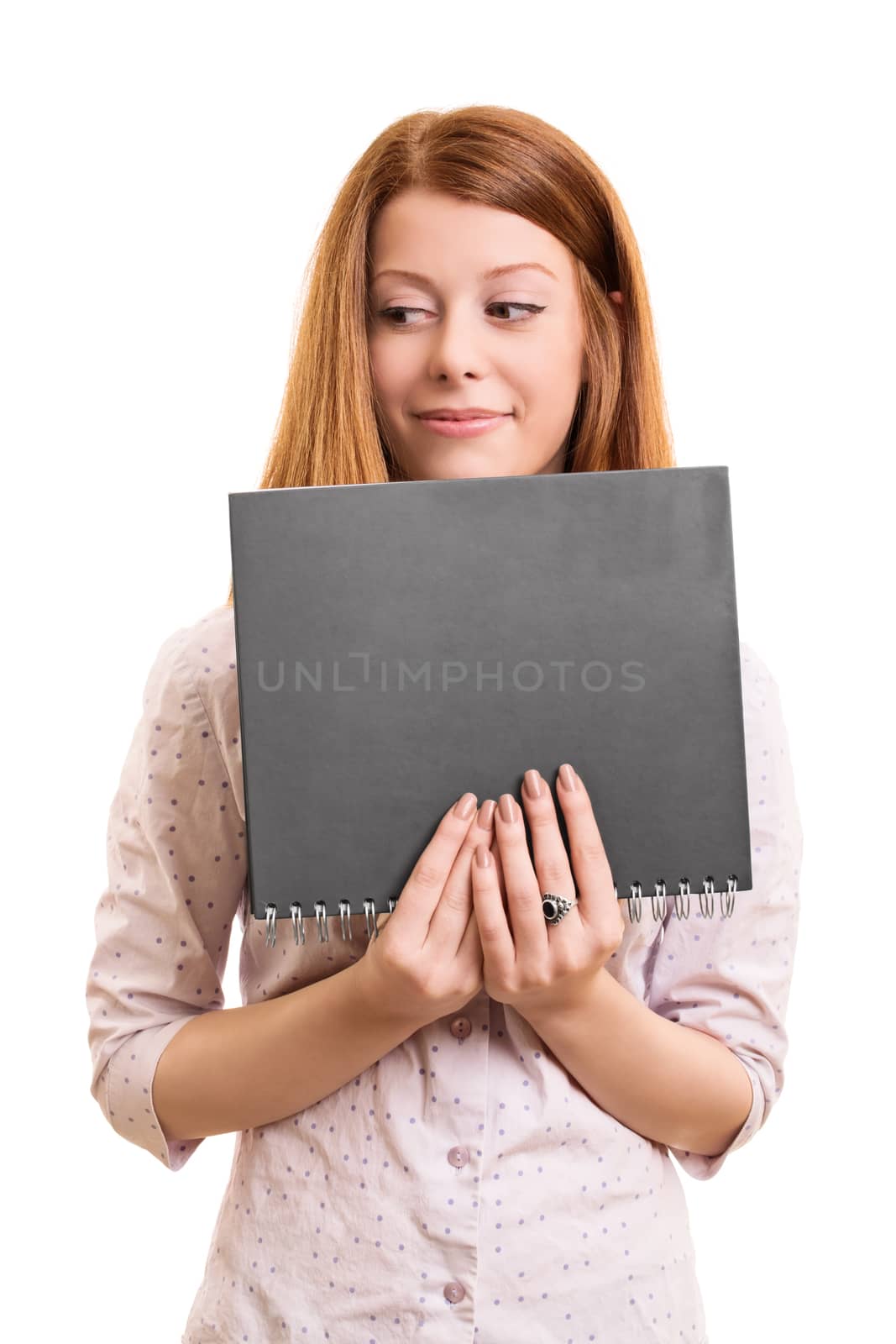A portrait of a smiling beautiful girl, holding a book, isolated on white background.