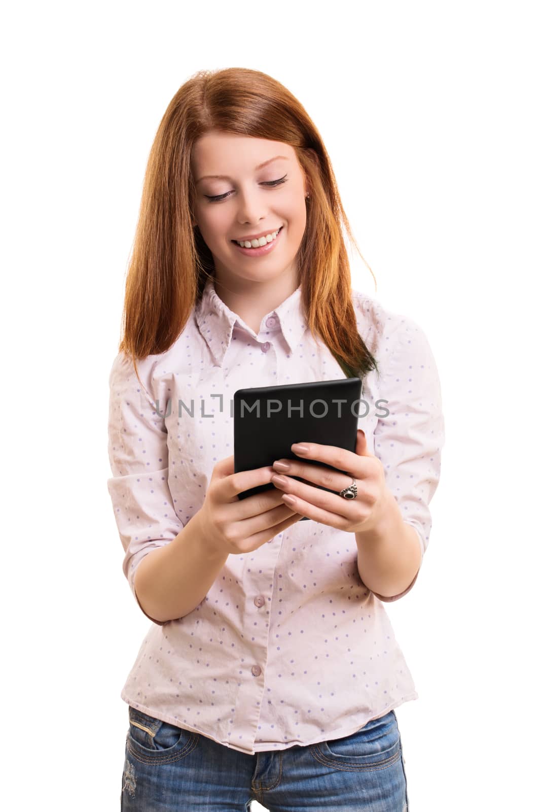 A portrait of a smiling female student holding a tablet, isolated on white background.