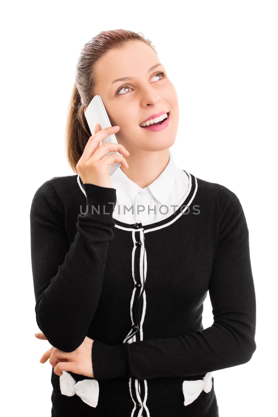 Smiling young girl talking on a phone by Mendelex