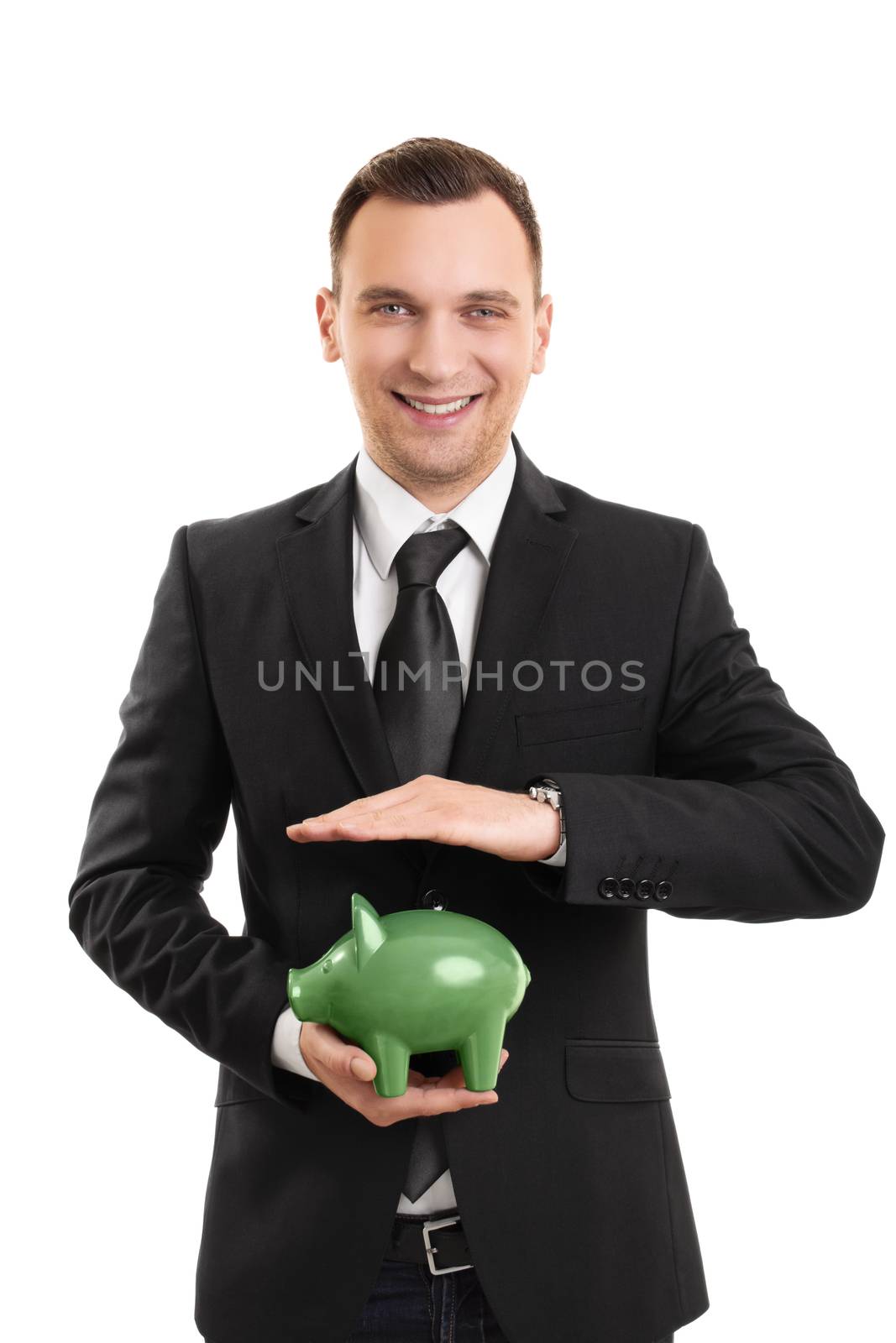 A portrait of a businessman holding a piggy bank, isolated on white background.